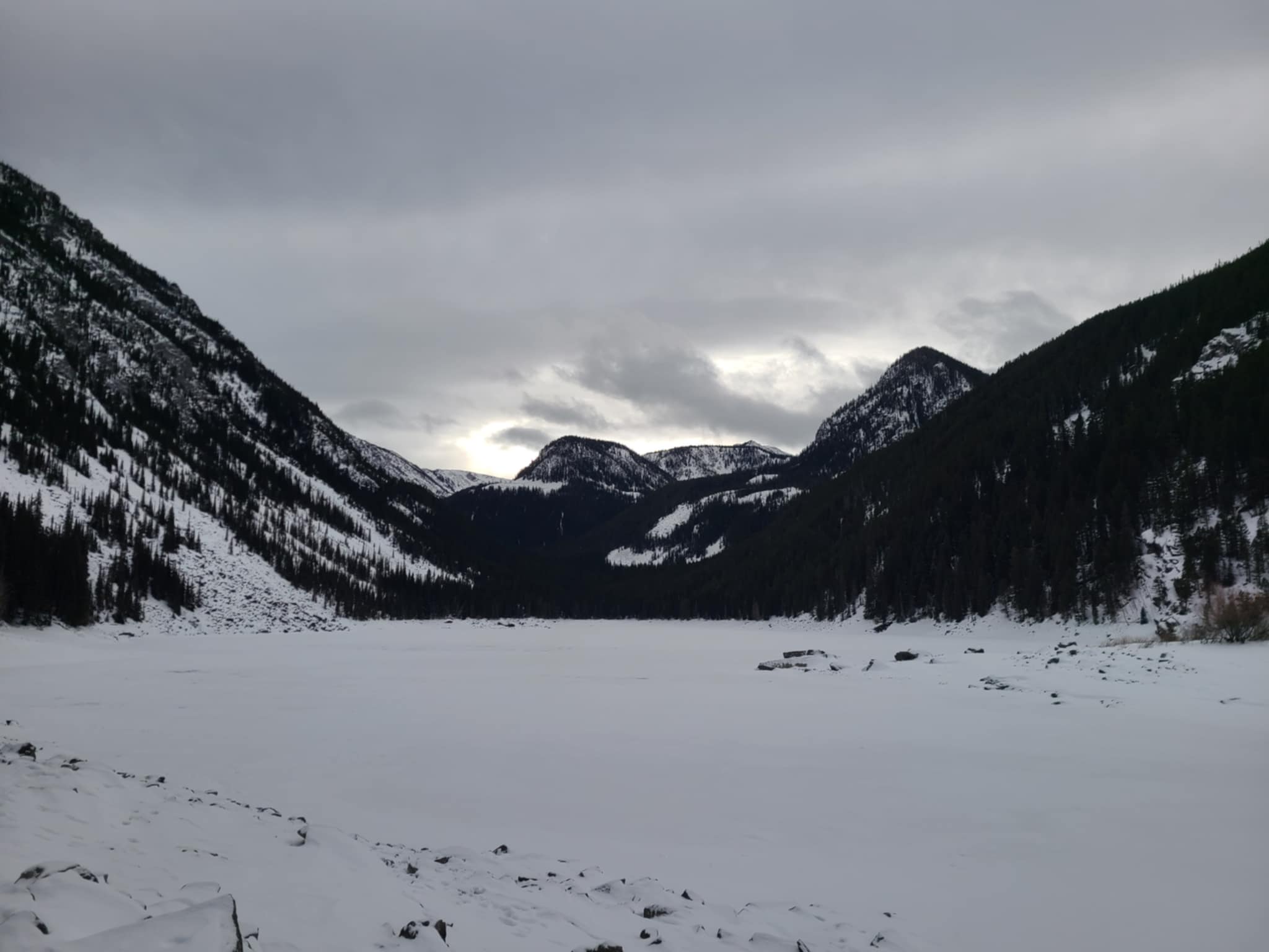 A frozen lake amidst the Rocky Mountains.